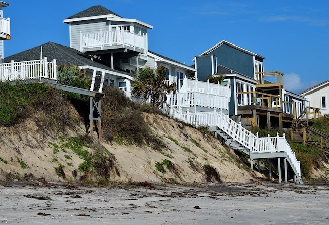 Homes on the coast affected by hurricane damage.