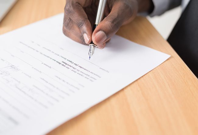 man singing a contract