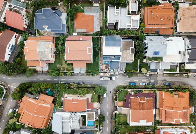 overhead image of a neighborhood and different colored roofs of those houses