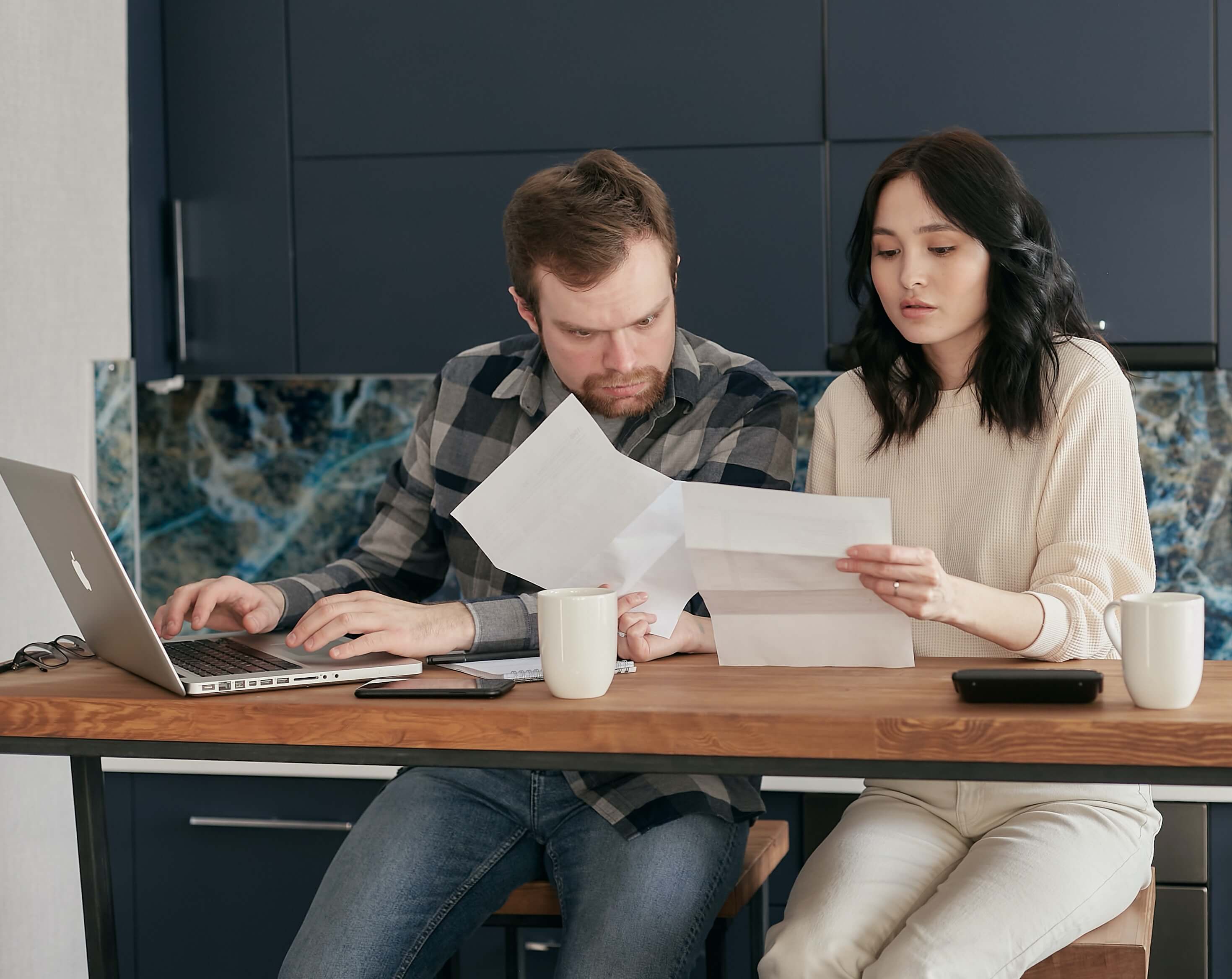 A couple reviews a letter they received stating that a tax lien was placed on their home.